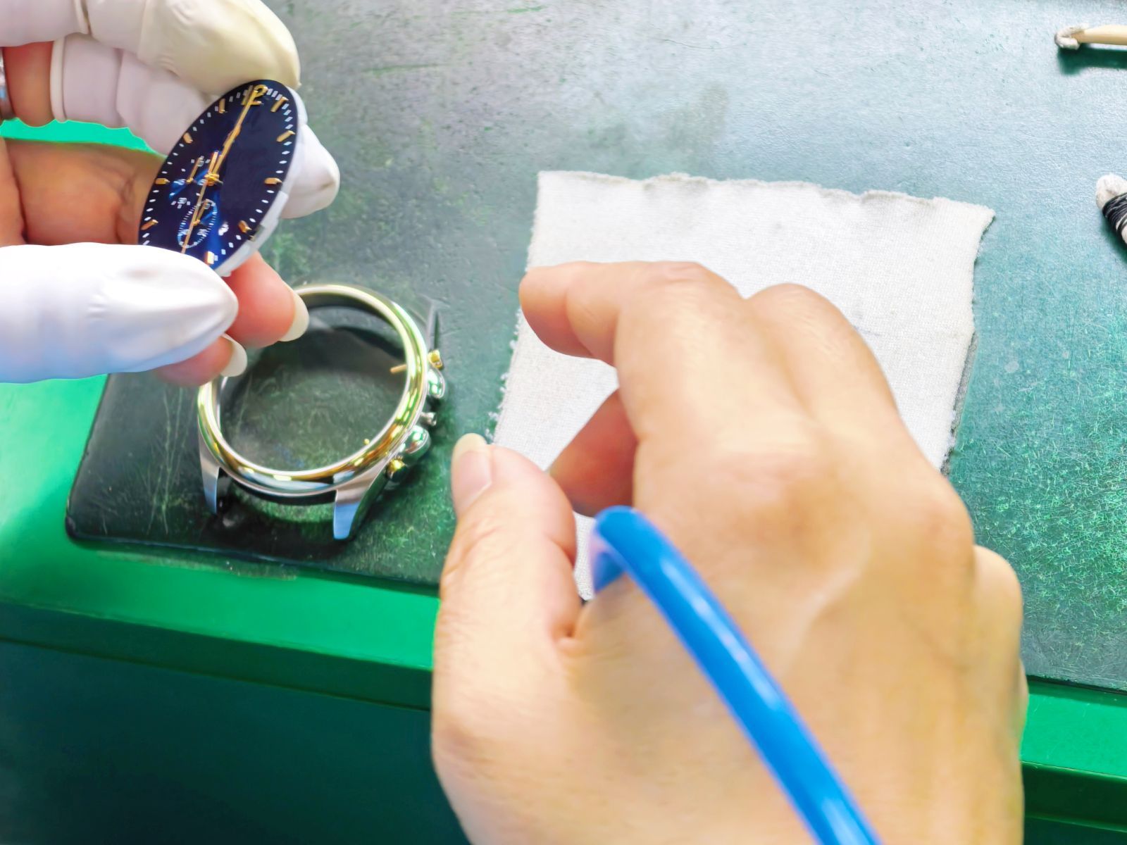 Case assembly and watch head preparation in the factory workflow.