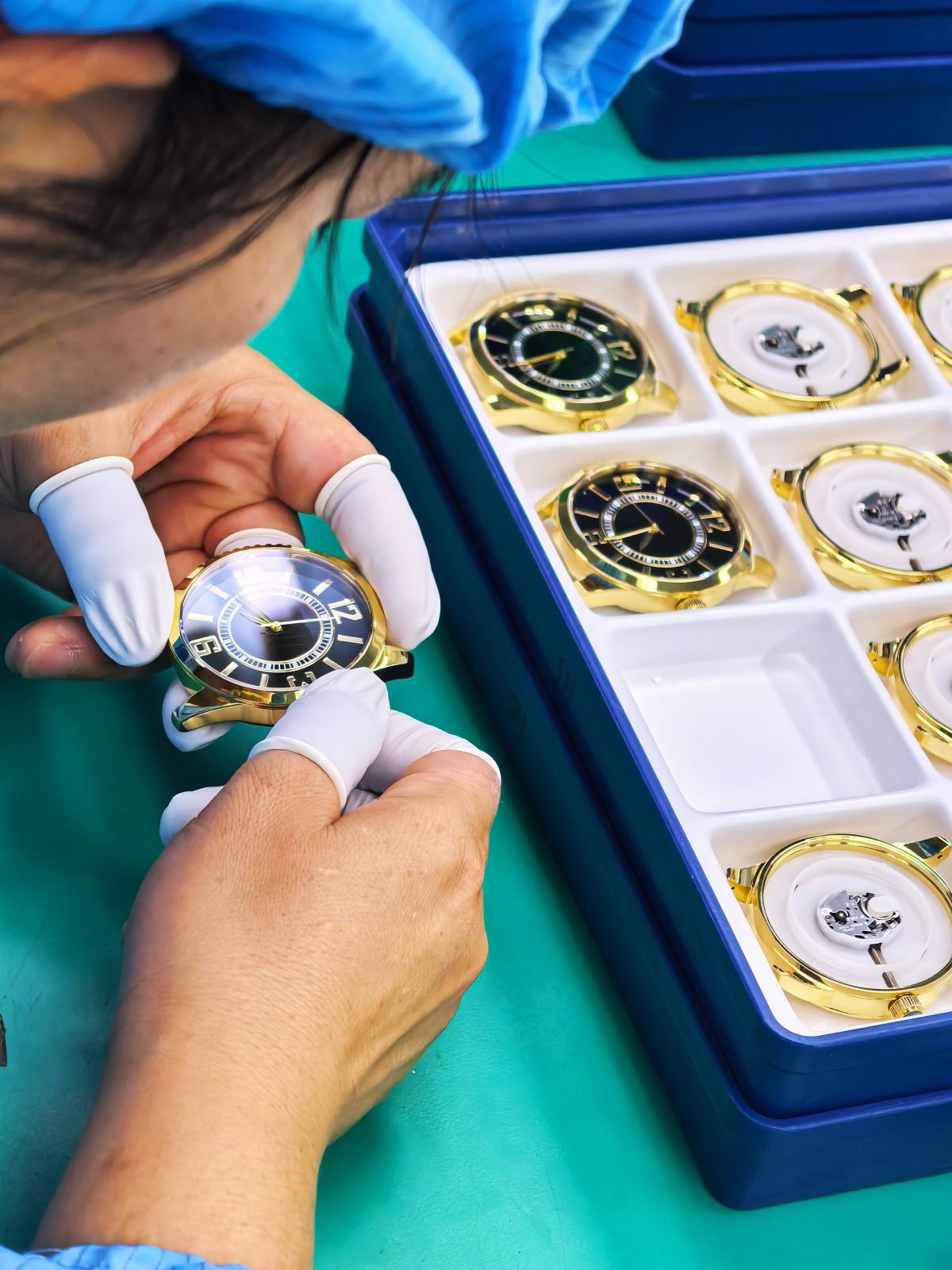 Case fit and assembly review during OEM watch production.